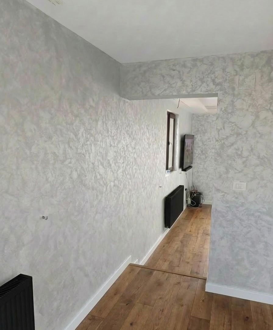 Silver textured decorative paint feature wall in a hallway