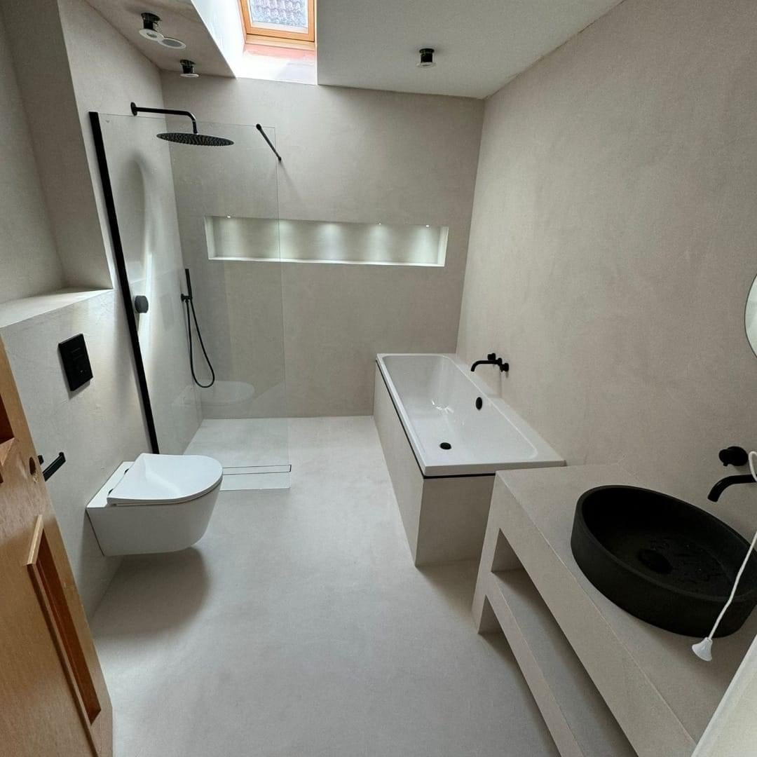 Microcement bathroom with walk-in shower and bath